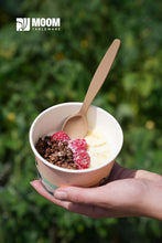 Load image into Gallery viewer, Reusable biodegradable spoon in hand, serving dessert in a cup with raspberries and granola, outdoors.