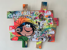 Load image into Gallery viewer, Pop art tableau featuring Gaston Lagaffe with vibrant colors, textures, and playful expressions on palette wood.