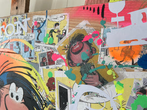 Vibrant pop art tableau featuring Gaston Lagaffe characters in colorful splashes and textures on wooden palette.