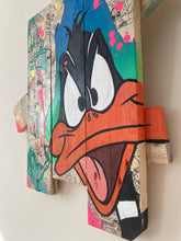 Laden Sie das Bild in den Galerie-Viewer, Contemporary pop art tableau of Daffy Duck on palette wood, vibrant colors and expressive design.