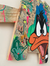 Laden Sie das Bild in den Galerie-Viewer, Contemporary pop art interpretation of Daffy Duck on wooden palette, vibrant colors and techniques.