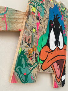 Contemporary pop art interpretation of Daffy Duck on wooden palette, vibrant colors and techniques.