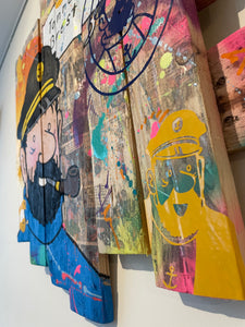 Pop Art tableau of Captain Haddock on wooden palette boards, featuring bright colors and bold design.