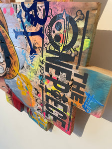 Tableau POP Art One Piece featuring Monkey D. Luffy on textured palette wood with vibrant colors and graffiti style.