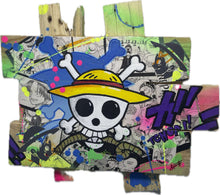 Load image into Gallery viewer, &quot;Handcrafted One Piece pop art tableau on custom wooden palette base, featuring manga collages and vibrant acrylic paint details.&quot;